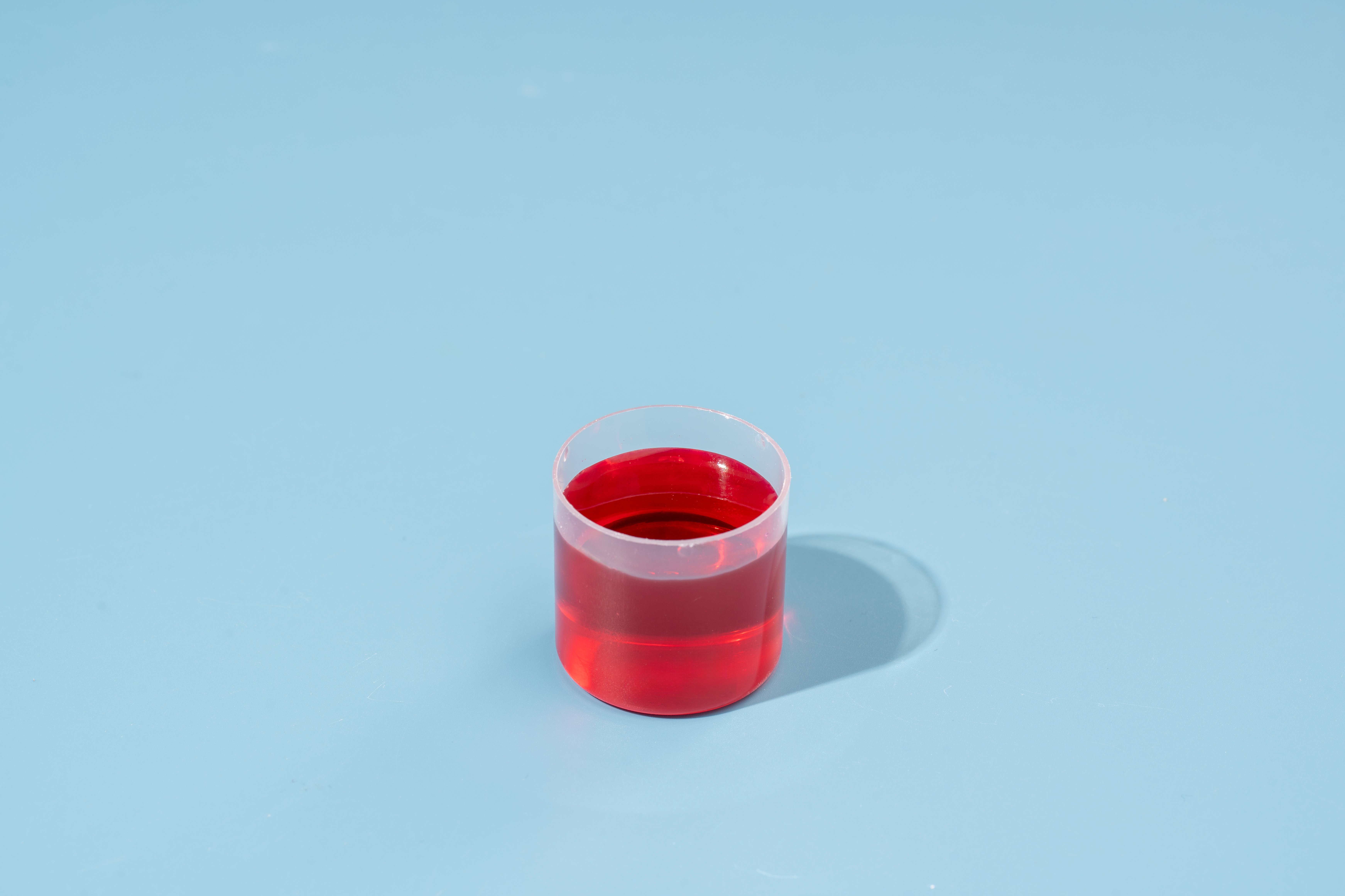 Shot of collagen from Swedish Nutra in a blue background